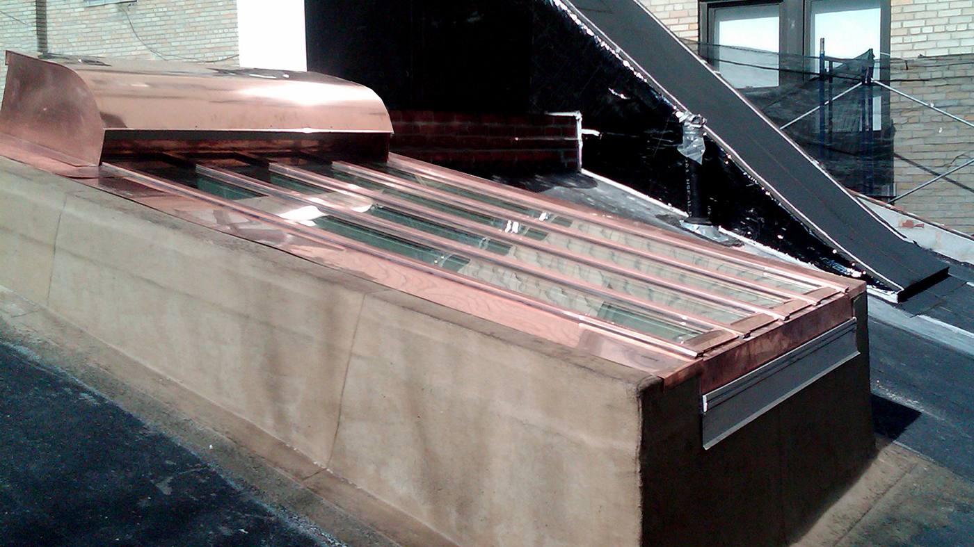 Copper clad single slope skylight with air intake