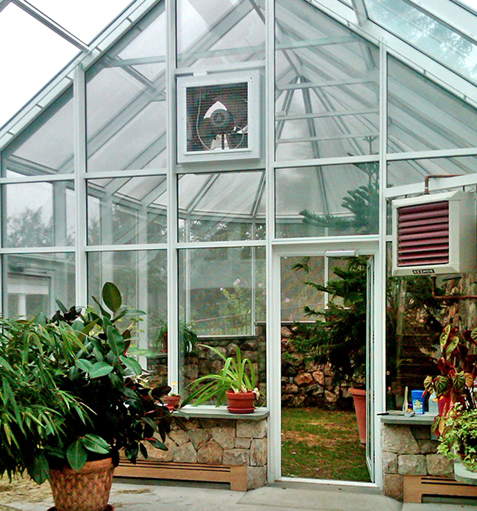 Straight eave double pitch conservatory with ridge vents and awning windows. The conservatory has an attached irregular conservatory nose conservatory with a stepped configuration used for raising turtles. The turtle conservatory uses specialty pet screen.