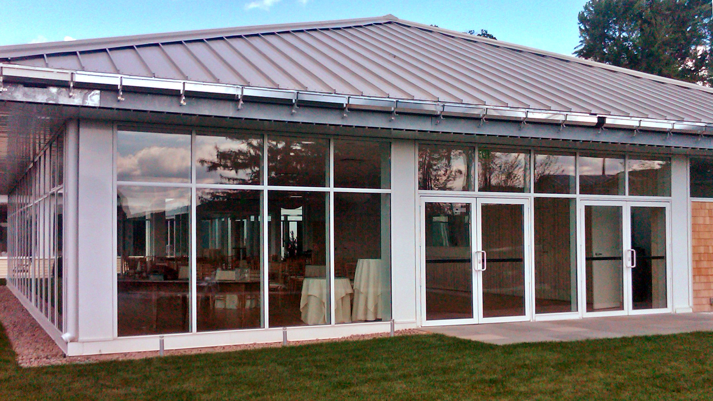 Aluminum curtain wall with integrated French doors.