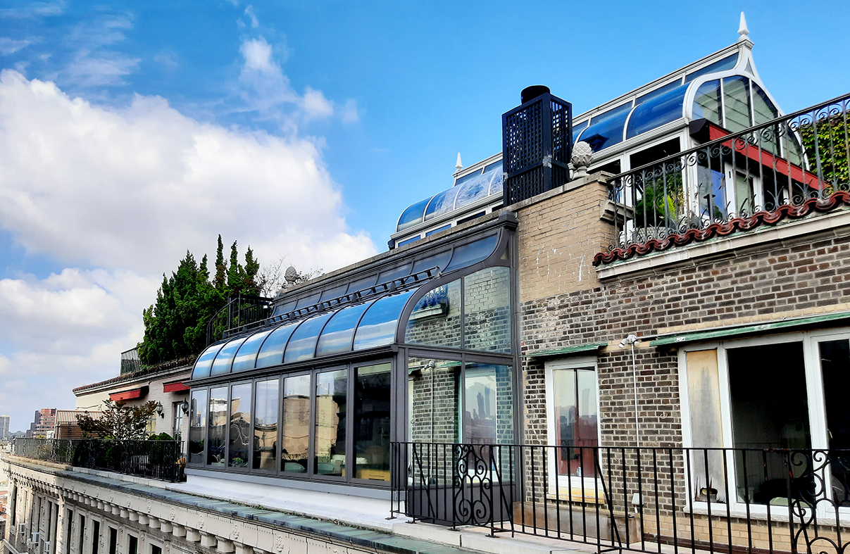 Curved Eave Double Pitch Sunroom(Ogee style) located in New York City's Central Park West District. NYC traffic was re-routed for install and the project was featured on DIY Network's 