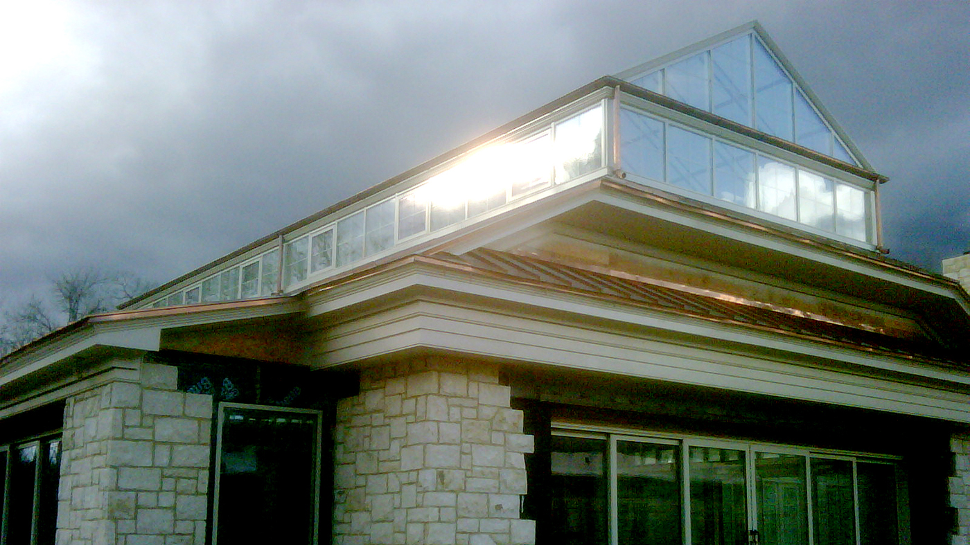 Straight eave double pitch skylight with gridded transom windows