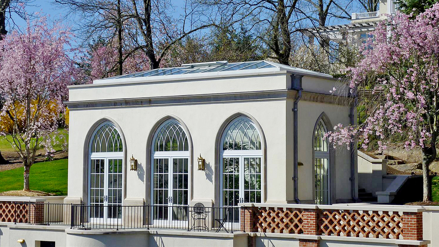 One straight eave double-pitch skylight with two hip ends, five aluminum curtain walls with intricate gothic arches, three with integrated G2 inswing French doors and two with integrated G2 inswing terrace doors, and two circular fixed windows. 