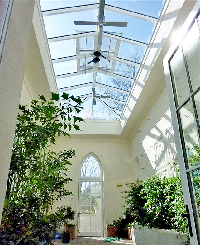One straight eave double-pitch skylight with two hip ends, five aluminum curtain walls with intricate gothic arches, three with integrated G2 inswing French doors and two with integrated G2 inswing terrace doors, and two circular fixed windows. 