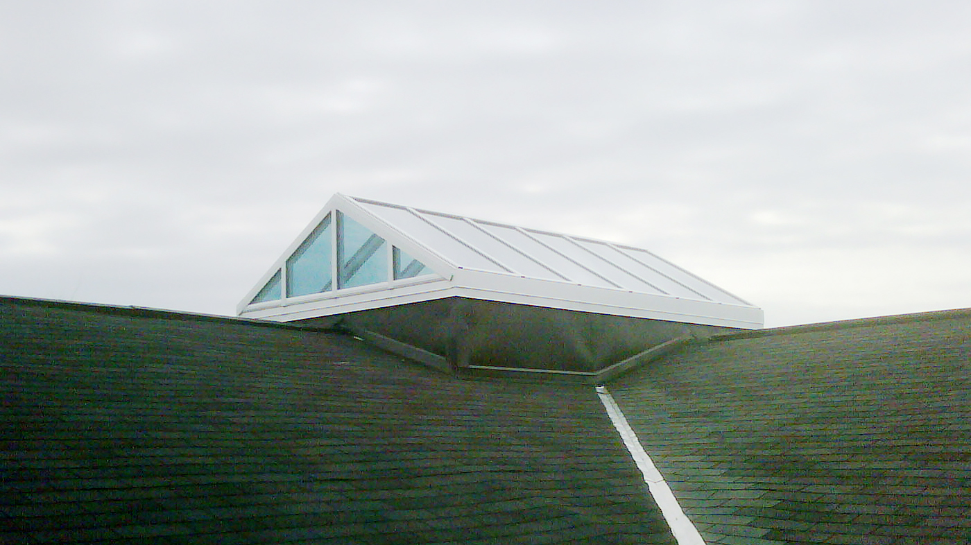 Straight eave double pitch skylight with two gable ends.