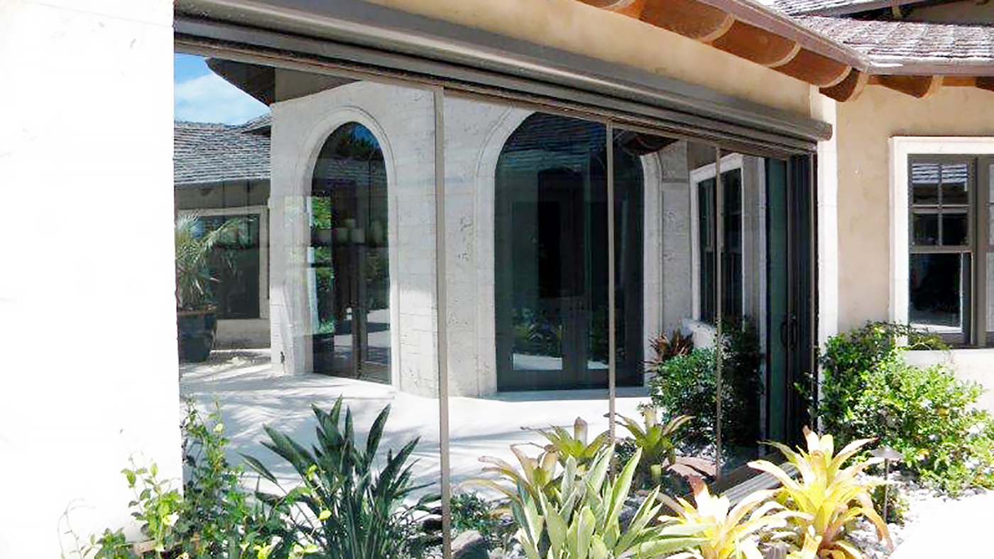 Two multi track sliding glass doors and a 90 degree no post corner folding glass wall system.
