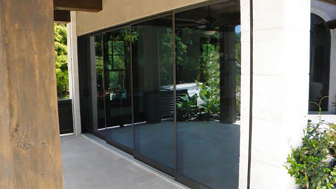 Two multi track sliding glass doors and a 90 degree no post corner folding glass wall system.