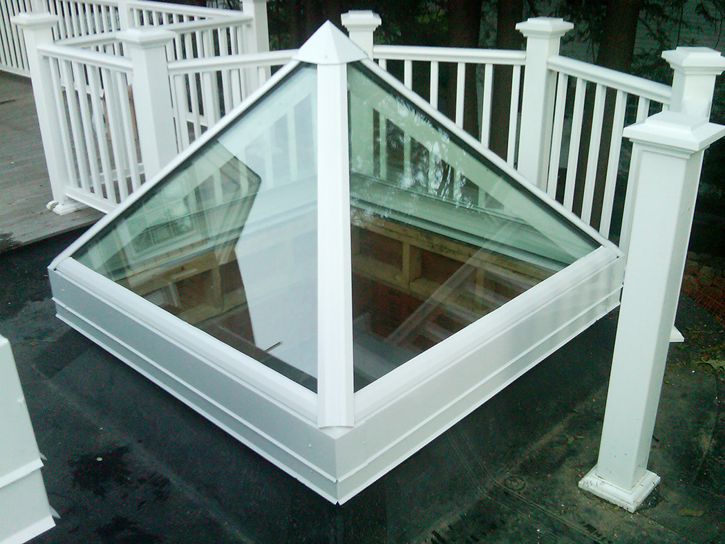 Straight eave double pitch skylight with two hip ends, and a pyramid skylight.