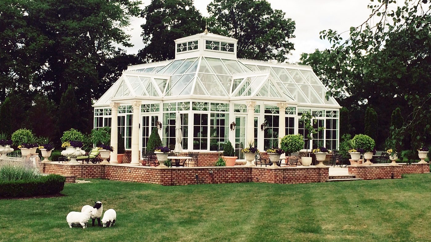 Straight eave pyramid conservatory with four double pitch lanterns, two interior partitions, transoms, gridwork, gable rake molding, gutter, downspout and a pyramid lantern.