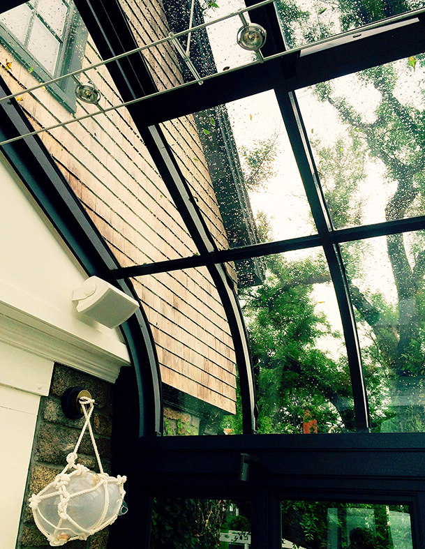 Curved eave conservatory skylight with irregular conservatory nose.