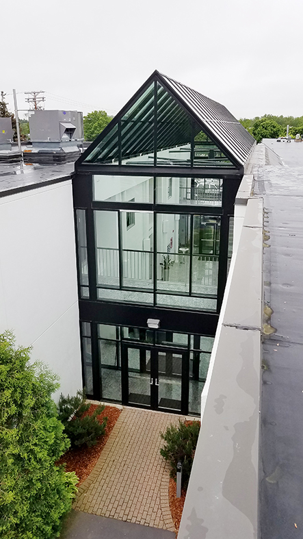 Straight Eave Double-Pitch Skylight with 2 Gable Ends. Vertical Wall Systems and Out-Swing French Terrace Door