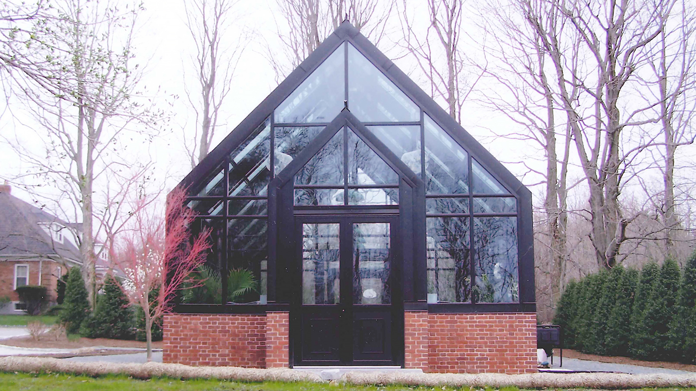 Straight eave double pitch greenhouse with two gable ends, interior partition wall, double pitch entryway, ridge vents, eave vents, French doors and two cold frames.