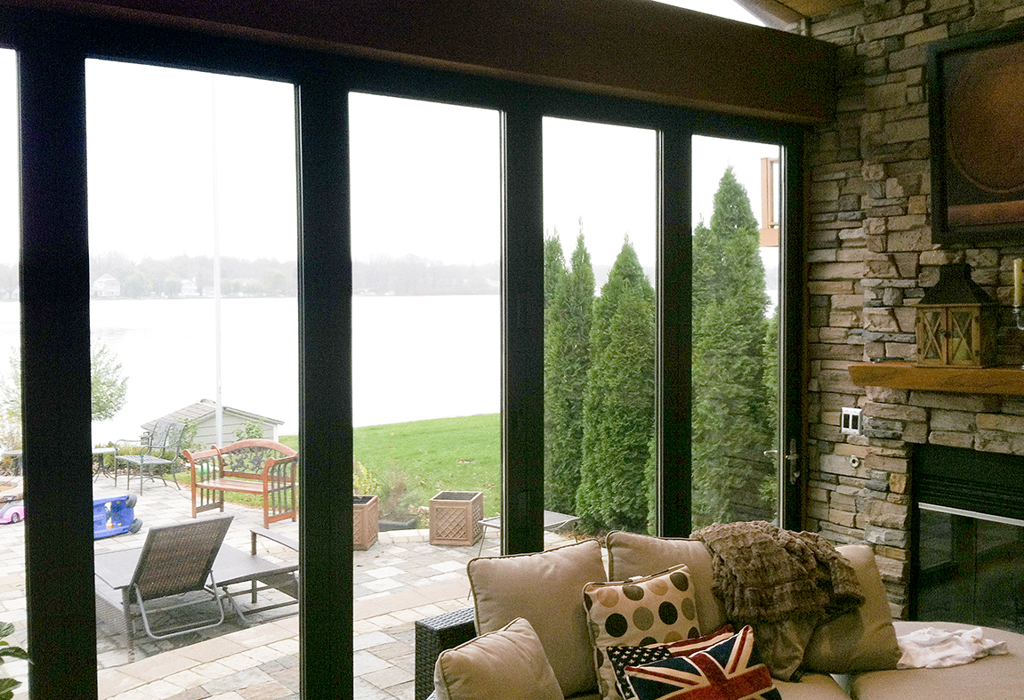 Two folding glass walls used in a sunroom application. Each door is a single door last panel with standard sills.