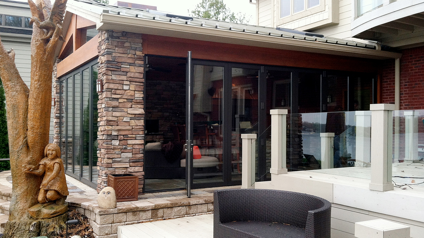 Two folding glass walls used in a sunroom application. Each door is a single door last panel with standard sills.