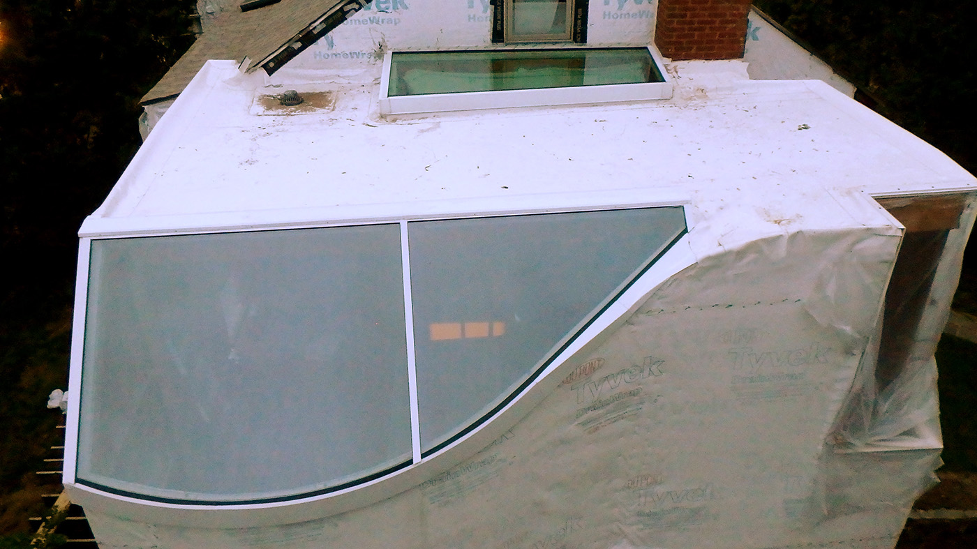 Single slope skylight with radiused sill and irregular shaped single slope skylight