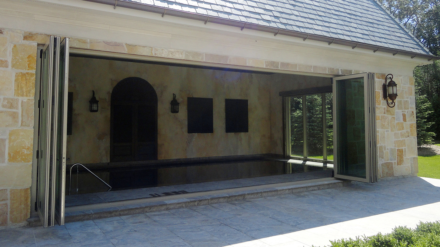 Pool enclosure with bifold doors