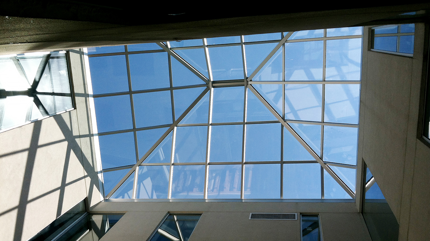 Straight eave double pitch skylight with two hip ends.