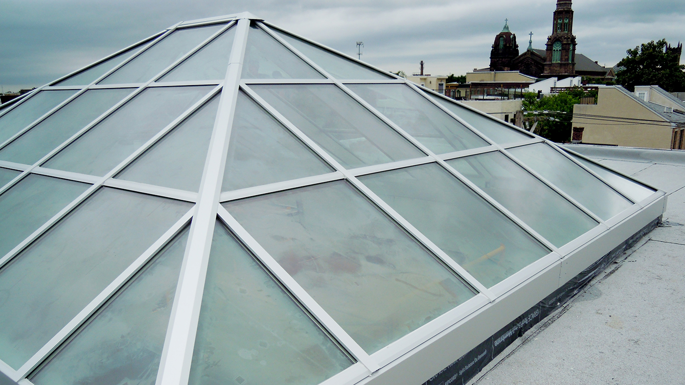 Straight eave double pitch skylight with two hip ends.