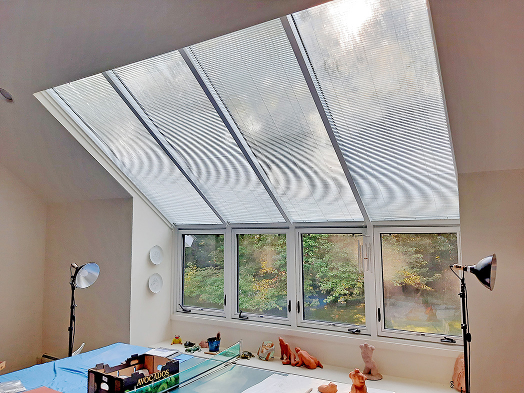 Straight eave lean to skylight with no gable ends, four casement windows and interior Douglas fir veneer.