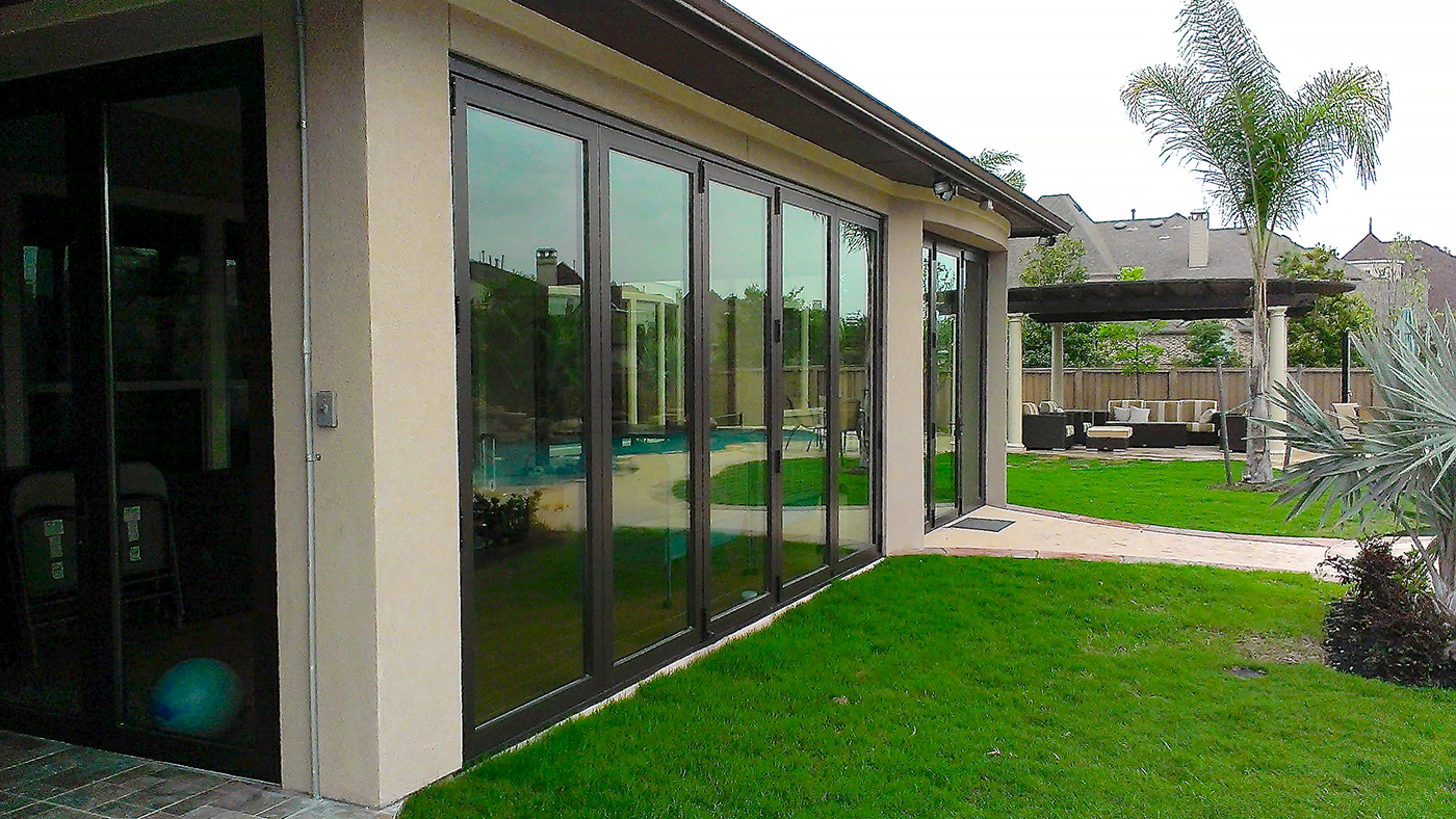 Four sets of folding glass walls with varying configurations, all using recessed sills.