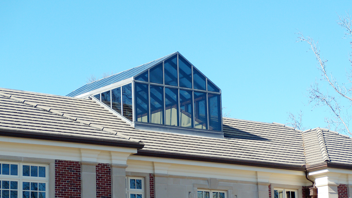 Straight eave, double pitch, Mahogany interior/aluminum exterior skylight with custom gable end.
