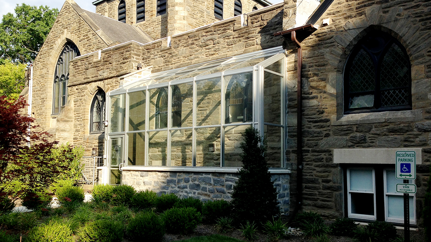 Straight eave lean-to sunroom with two gable ends, commercial terrace door, and manually operated ridge vent.
