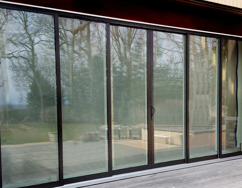 Multi track sliding glass door with OXXXXO configuration and two tone frame finish.