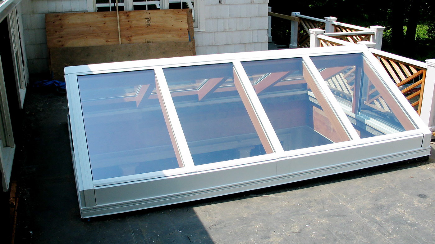 Straight eave, double pitch skylight with Mahogany interior.