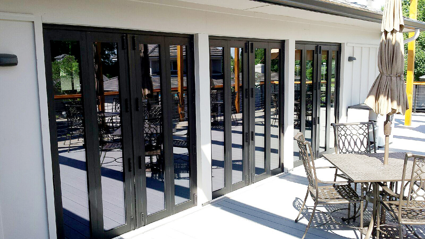 Three split wall, four-panel folding glass wall systems featuring Solar's G2 narrow framing system.