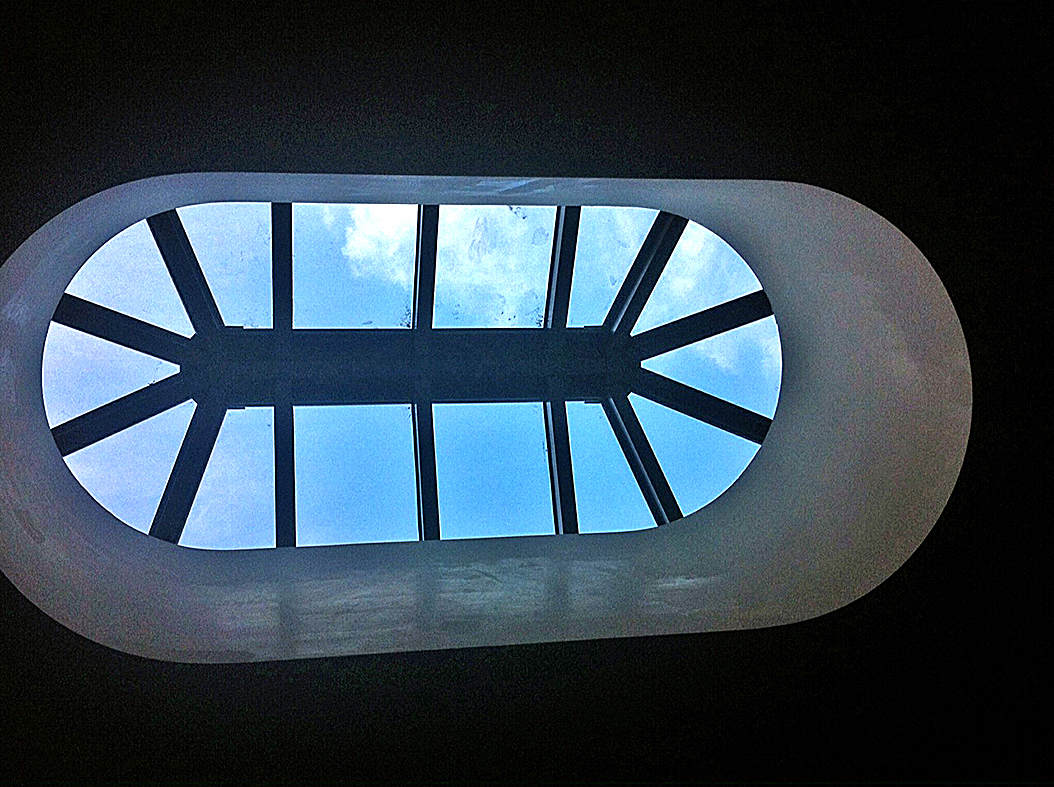 Irregular octagon skylight with 2 gable ends.