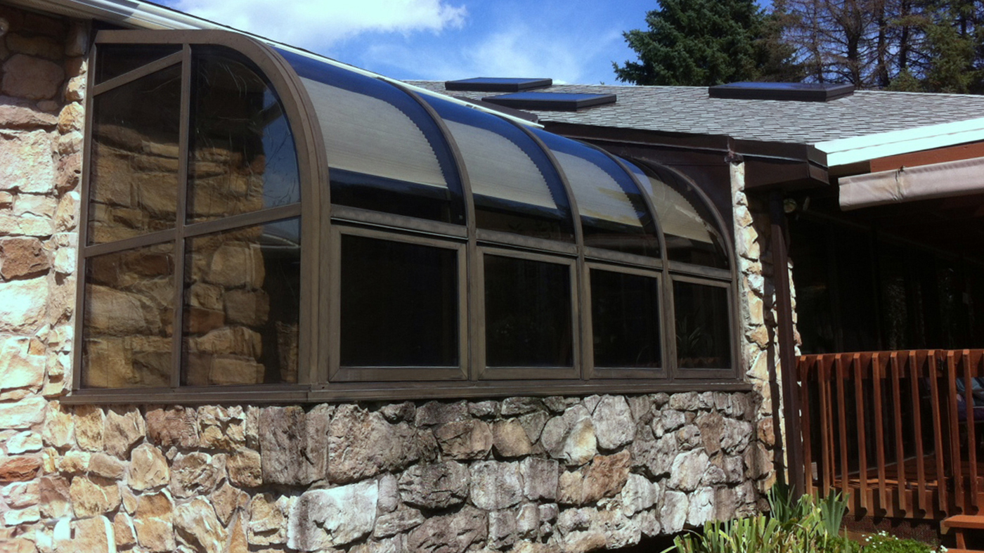 Curved glass replacement on this curved eave, lean-to sunroom.