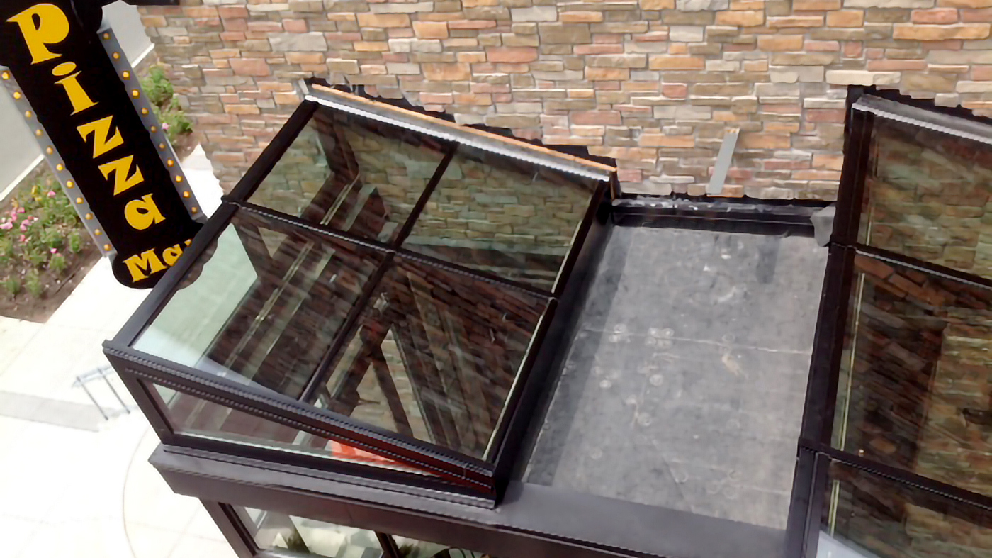 Multiple welded curb straight-eave lean-to skylights.