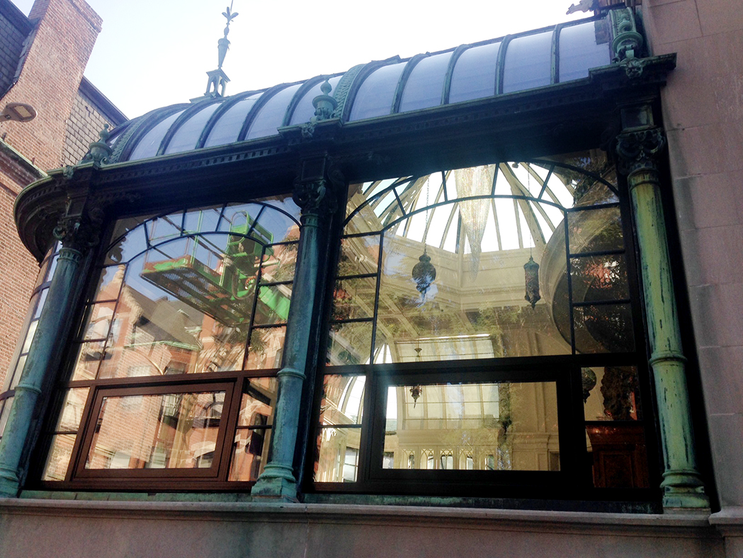 Restoration project on conservatory with aluminum curtain walls and radius glazing