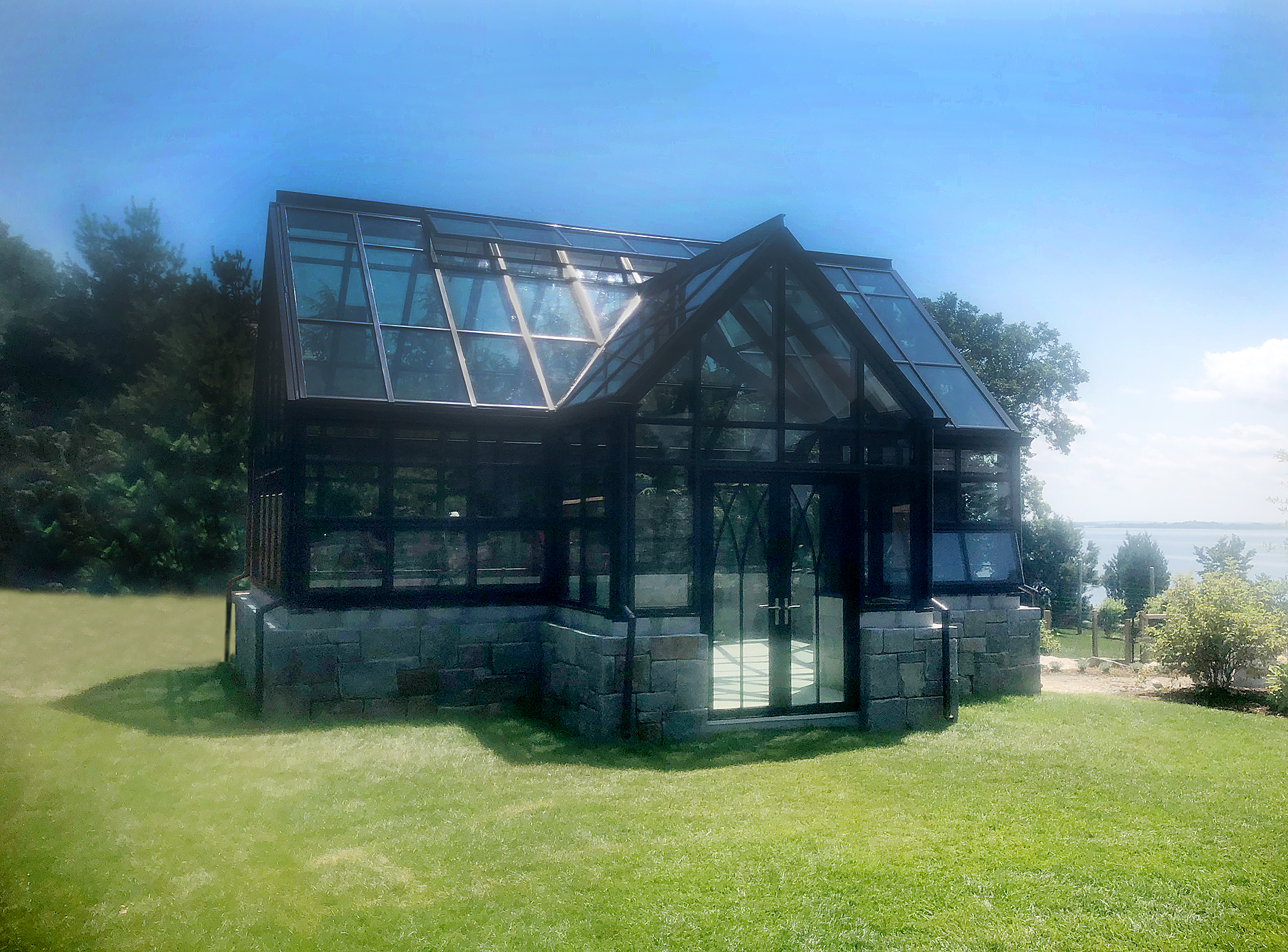 Greenhouse with gothic arch grid doors