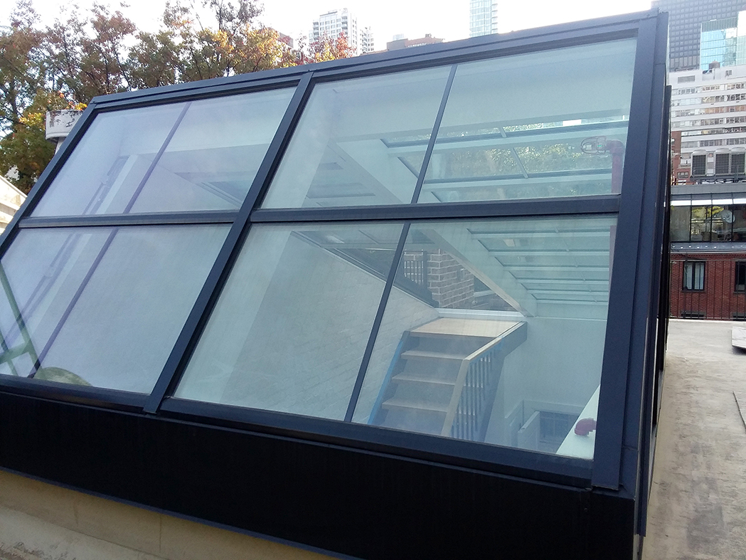 Straight eave double pitch retractable skylight