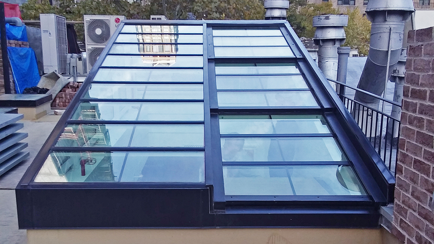 Straight eave double pitch retractable skylight