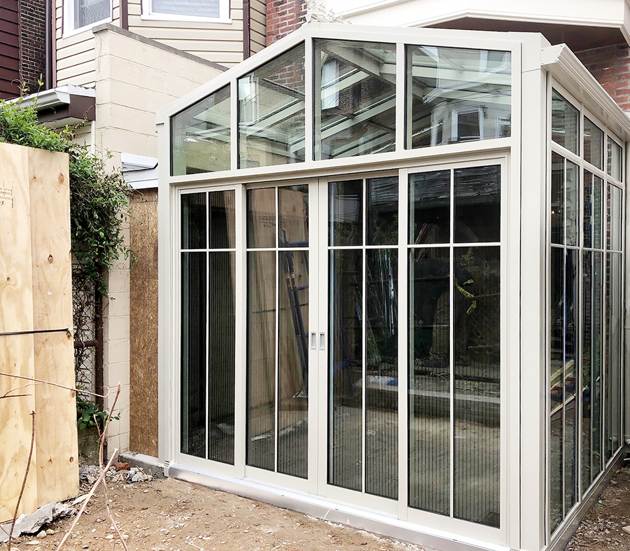 Straight eave double pitch sunroom with multi-track sliding glass doors and B-Series screens