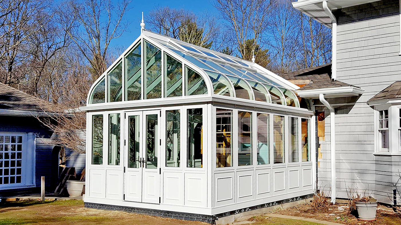 Curved eave double pitch greenhouse 