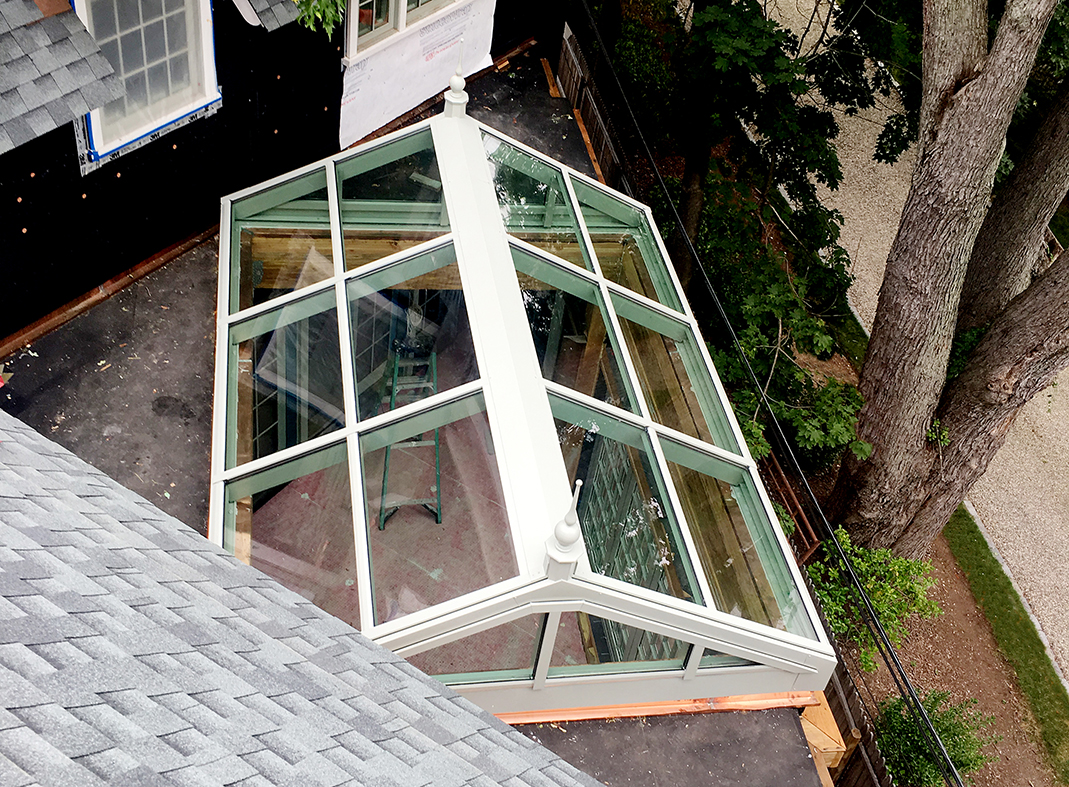 Bifold windows and straight eave double pitch skylight 