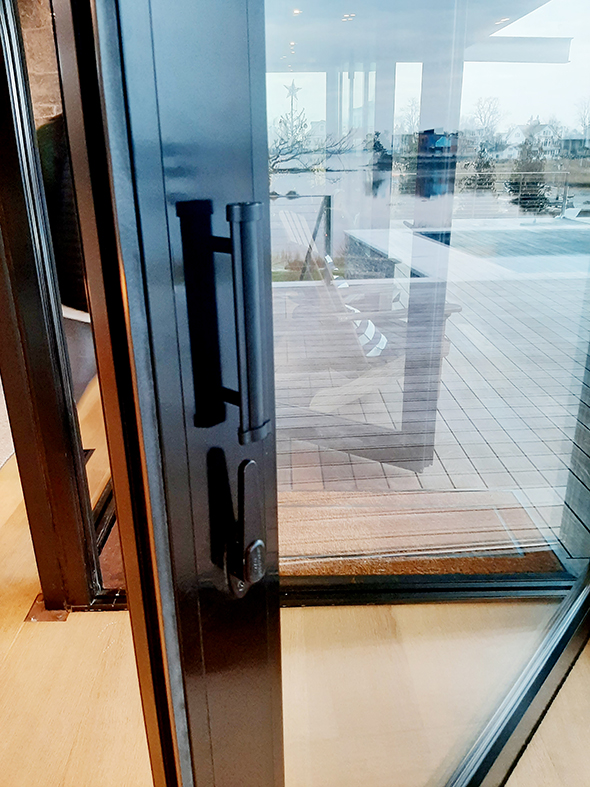 Two no corner post bifold door units, one three-panel bifold door unit, two curtain wall units, two multi-track sliding glass door units, four fixed window units