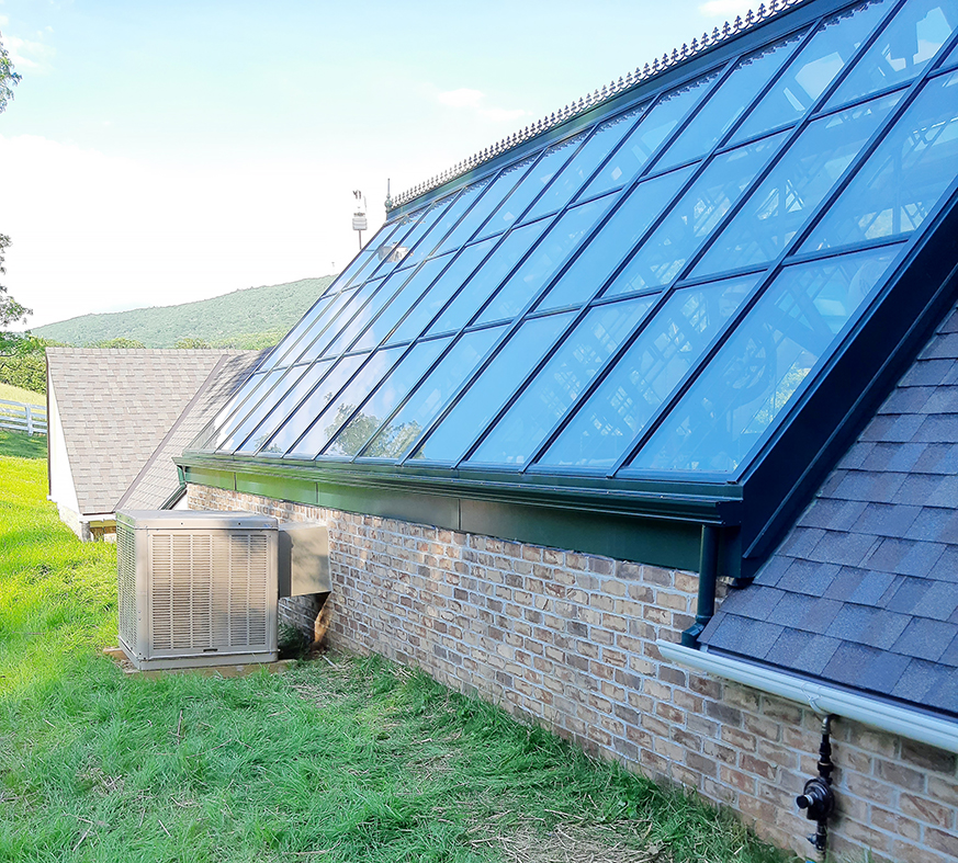 Straight eave double pitch greenhouse with a dormer, built into a slope with a weather station