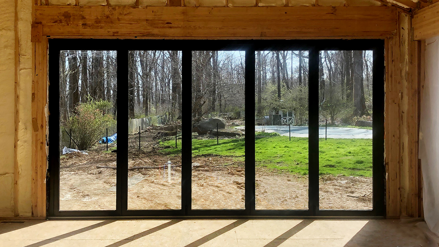 Three sets of bifold doors with B-Series retractable screens