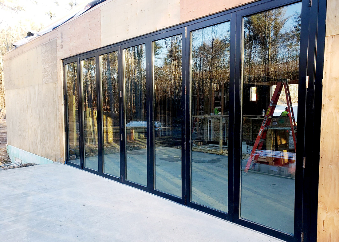Four six-panel floating bifold door systems