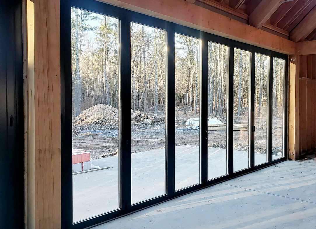 Four six-panel floating bifold door systems