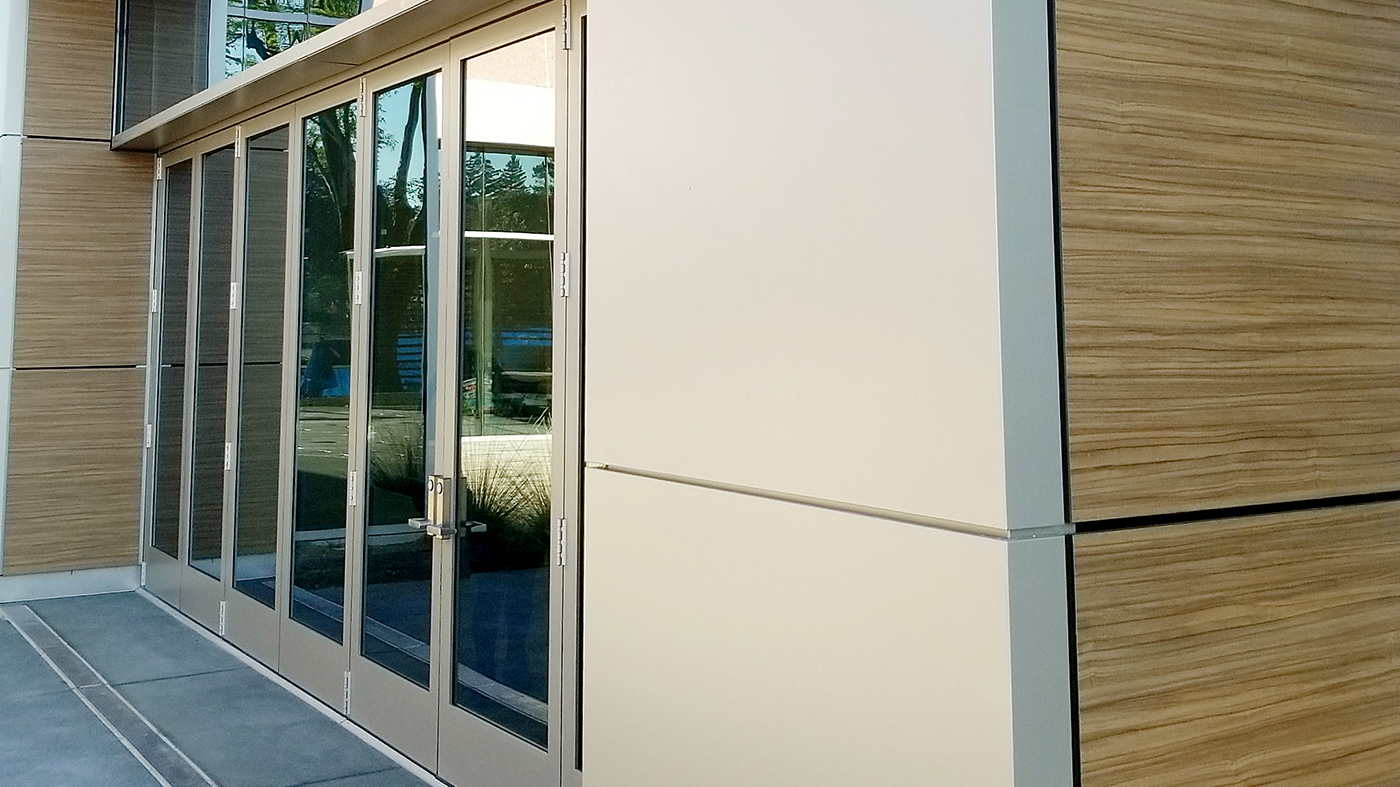 Two eight-panel G2 outfold double door mid-wall (DDMW) bifold door units.