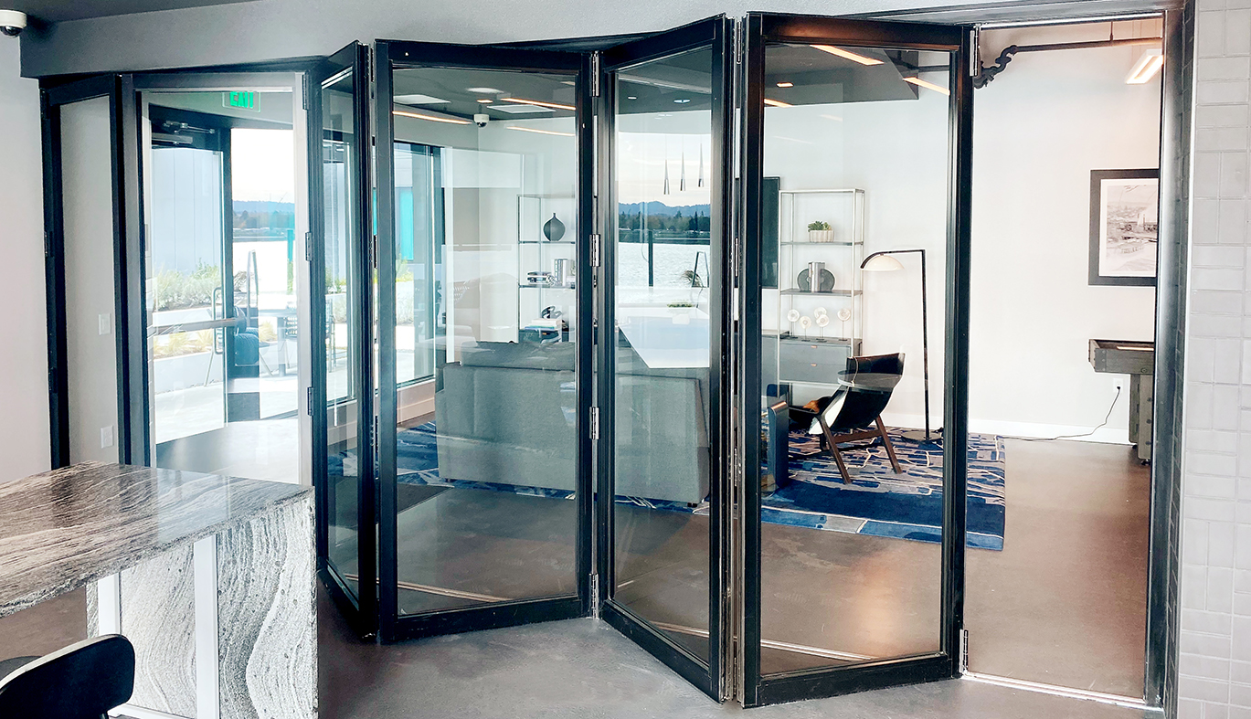 One five-panel multi-track sliding glass door system and one six-panel bifold door system