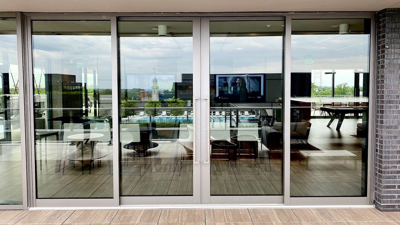 Three four-panel (OXXO configuration) G3 multi-track sliding glass door units with GeoMetek pull handles.