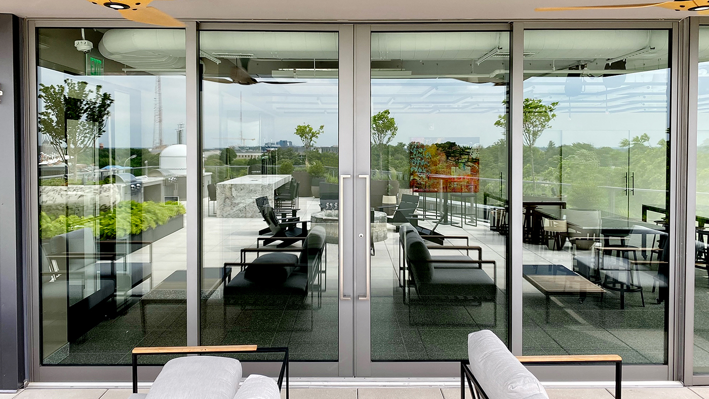Three four-panel (OXXO configuration) G3 multi-track sliding glass door units with GeoMetek pull handles.