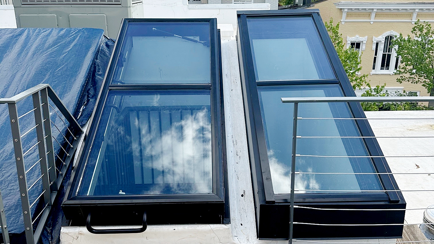 Two fixed single-slope skylights and one 80-90 degree operable skylight utilizing gas spring shocks.