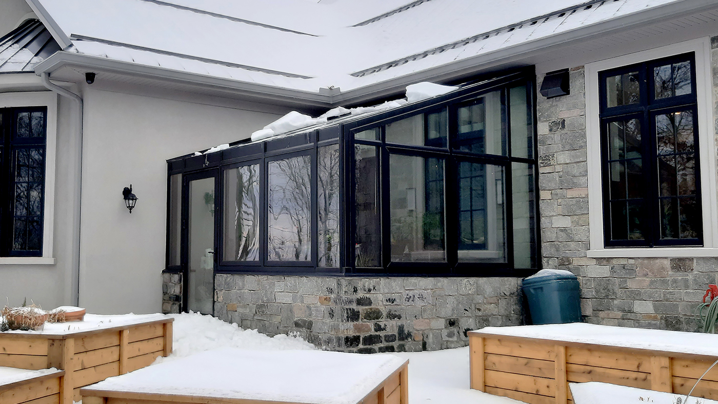 Straight eave lean-to greenhouse with on terrace door and four awnings windows