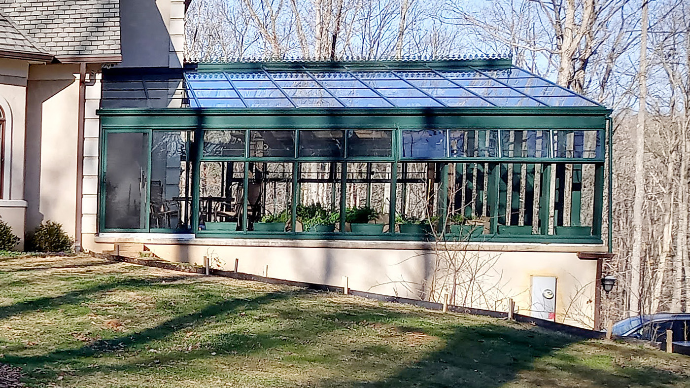 Straight eave double pitch greenhouse with two integrated two-panel (XO & OX configuration) G2 multi-track sliding glass door units.